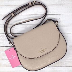 kate spade Beige Pebbled Leather Crossbody Saddle Bag with Gold Logo